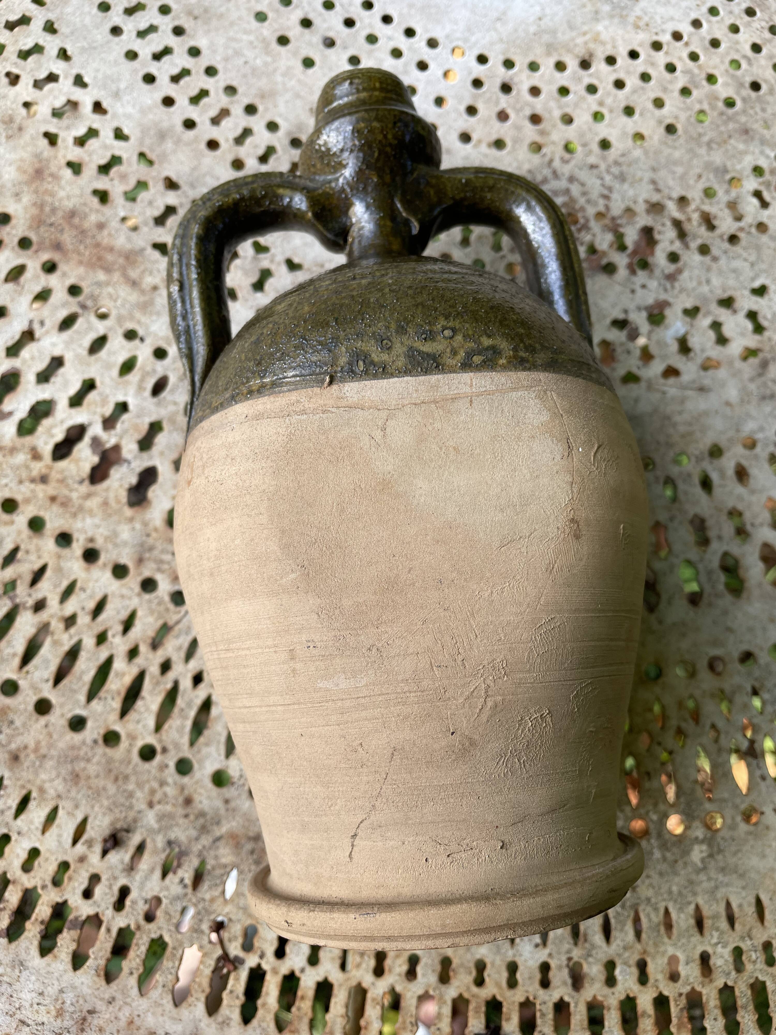 Persimmon glazed terracotta oil jar