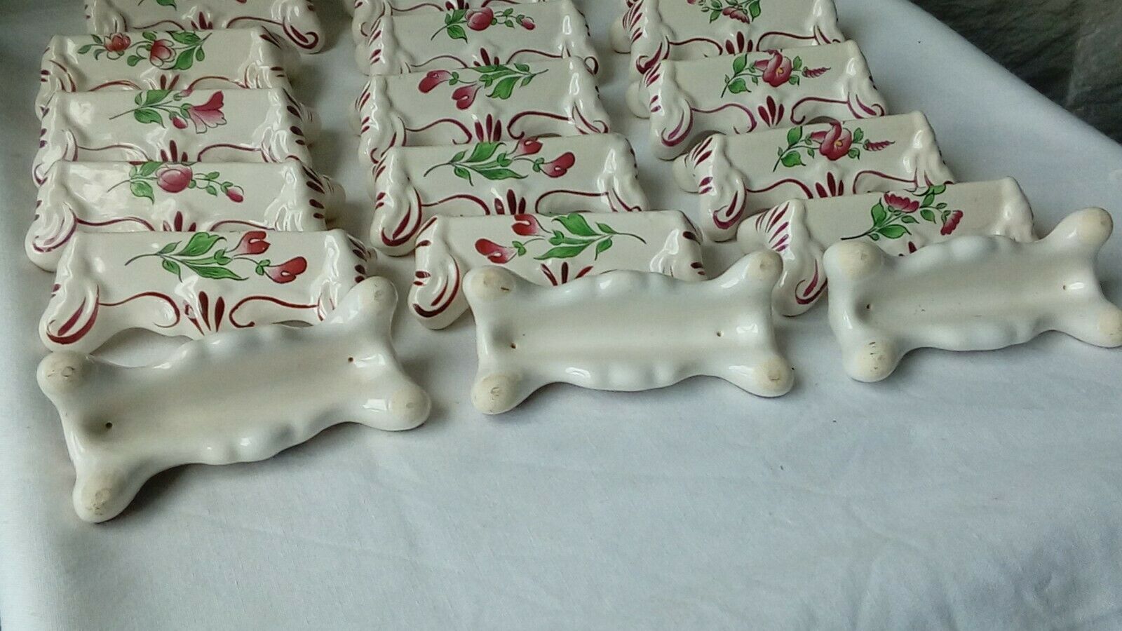 Suite of 18 knife holders in faience of luneville model reverbere