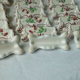 Suite of 18 knife holders in faience of luneville model reverbere