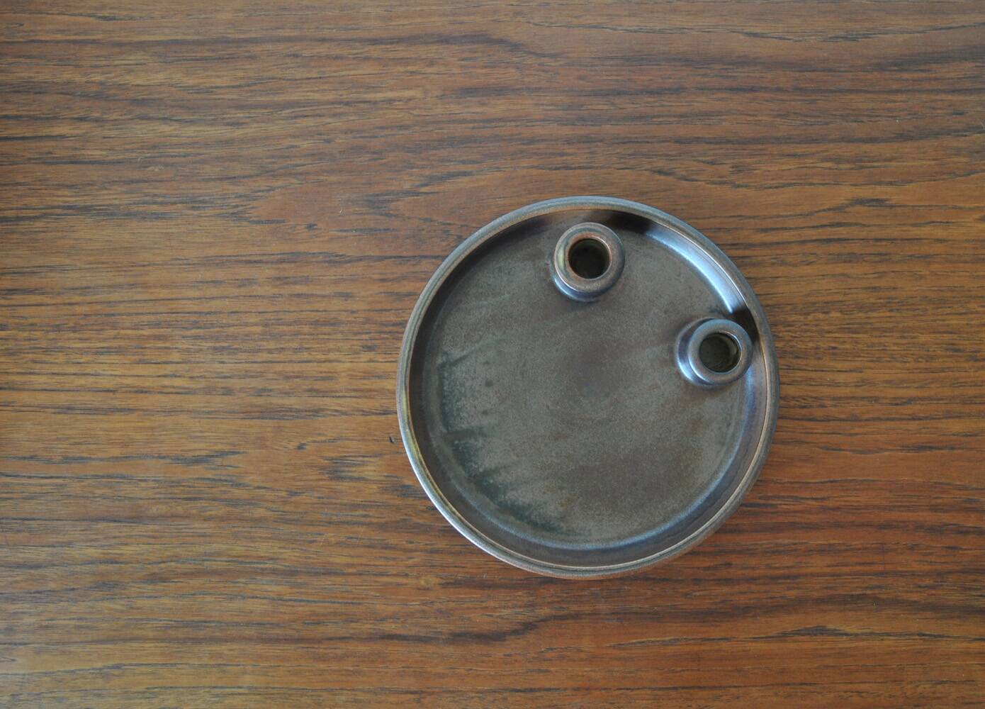 Candle holder made of stoneware with a harefur glaze