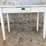 Table/desk with beige patinated square legs and black top