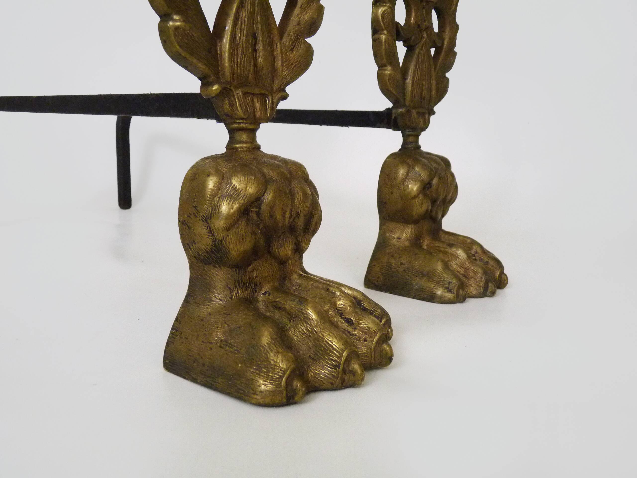 Pair of bronze fire dogs with lion paws. Early 20th century.