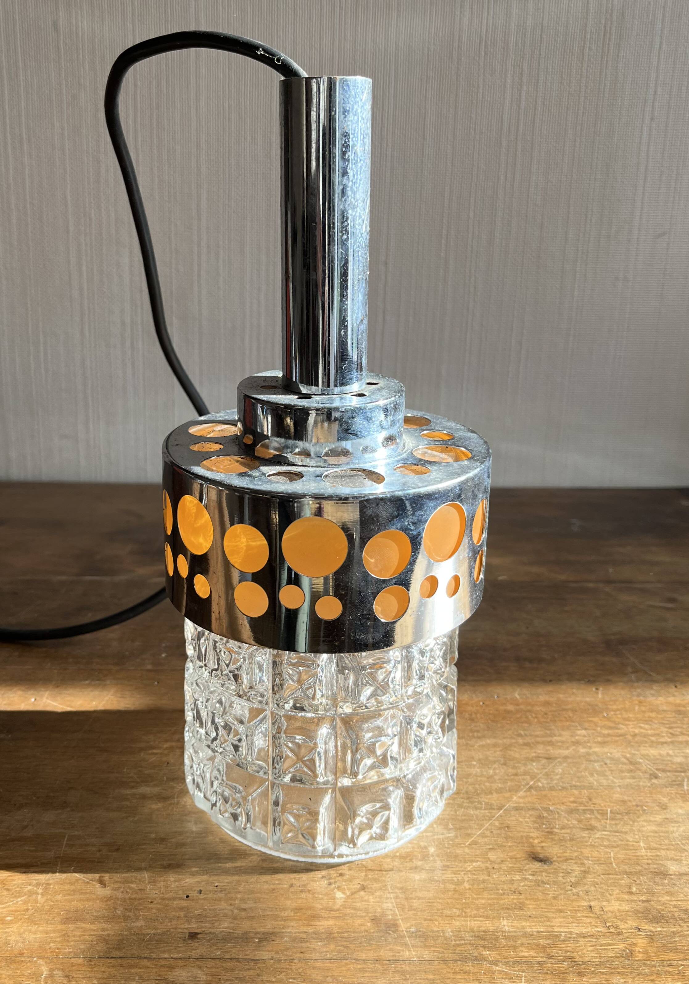 Small raak chrome and orange pendant light