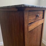 Vintage bedside table in the shape of a wooden column and a gray marble top