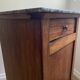Vintage bedside table in the shape of a wooden column and a gray marble top