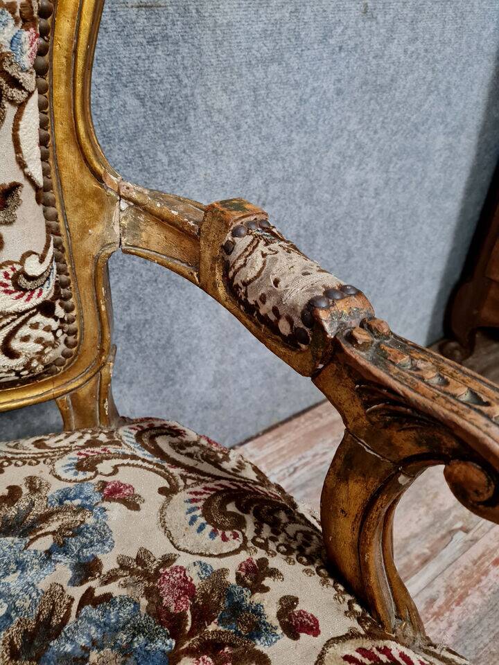 Pair of Louis XV style Baroque armchairs in gilded and carved wood circa 1900