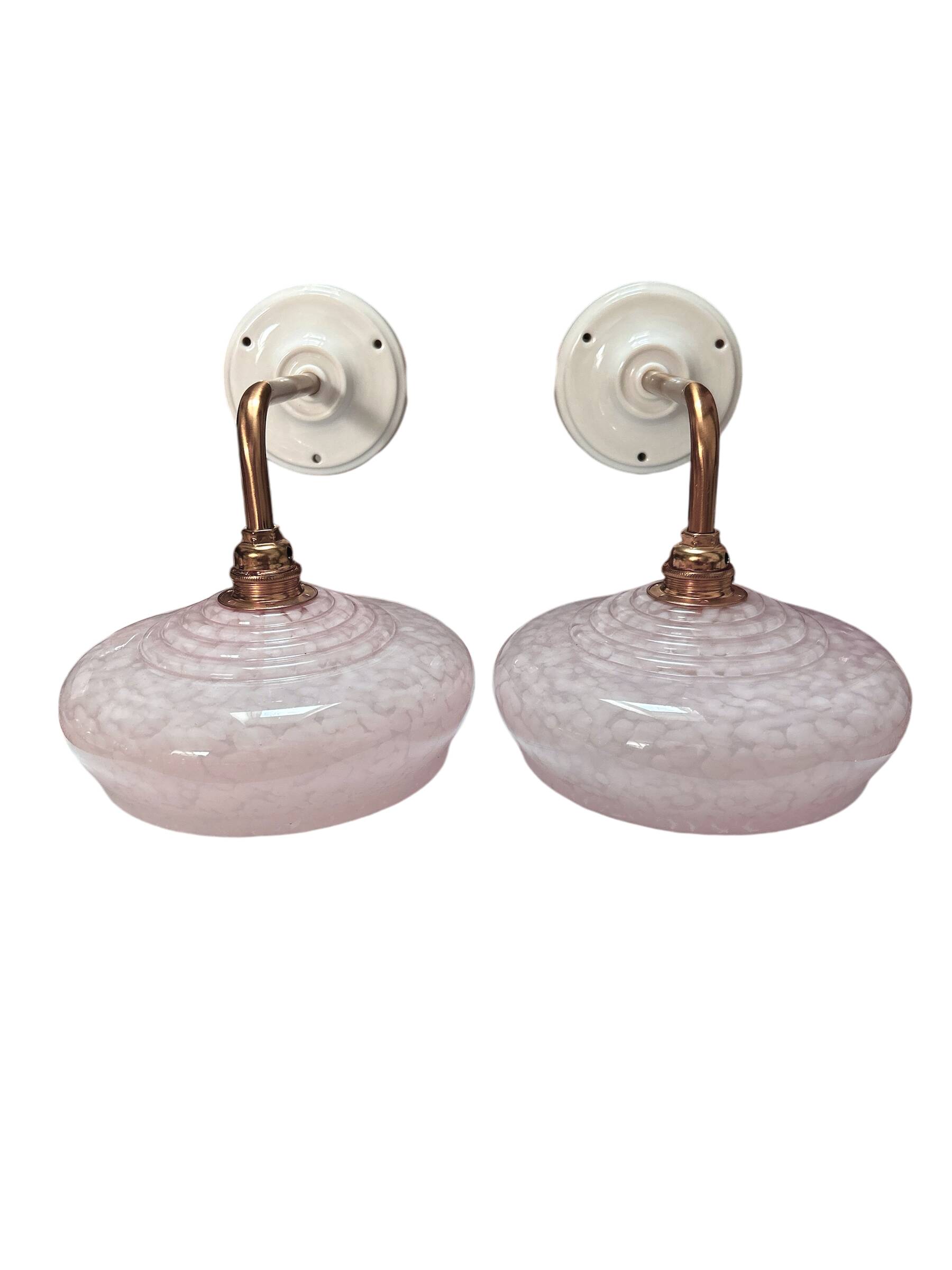 Pair of pink globe wall lights