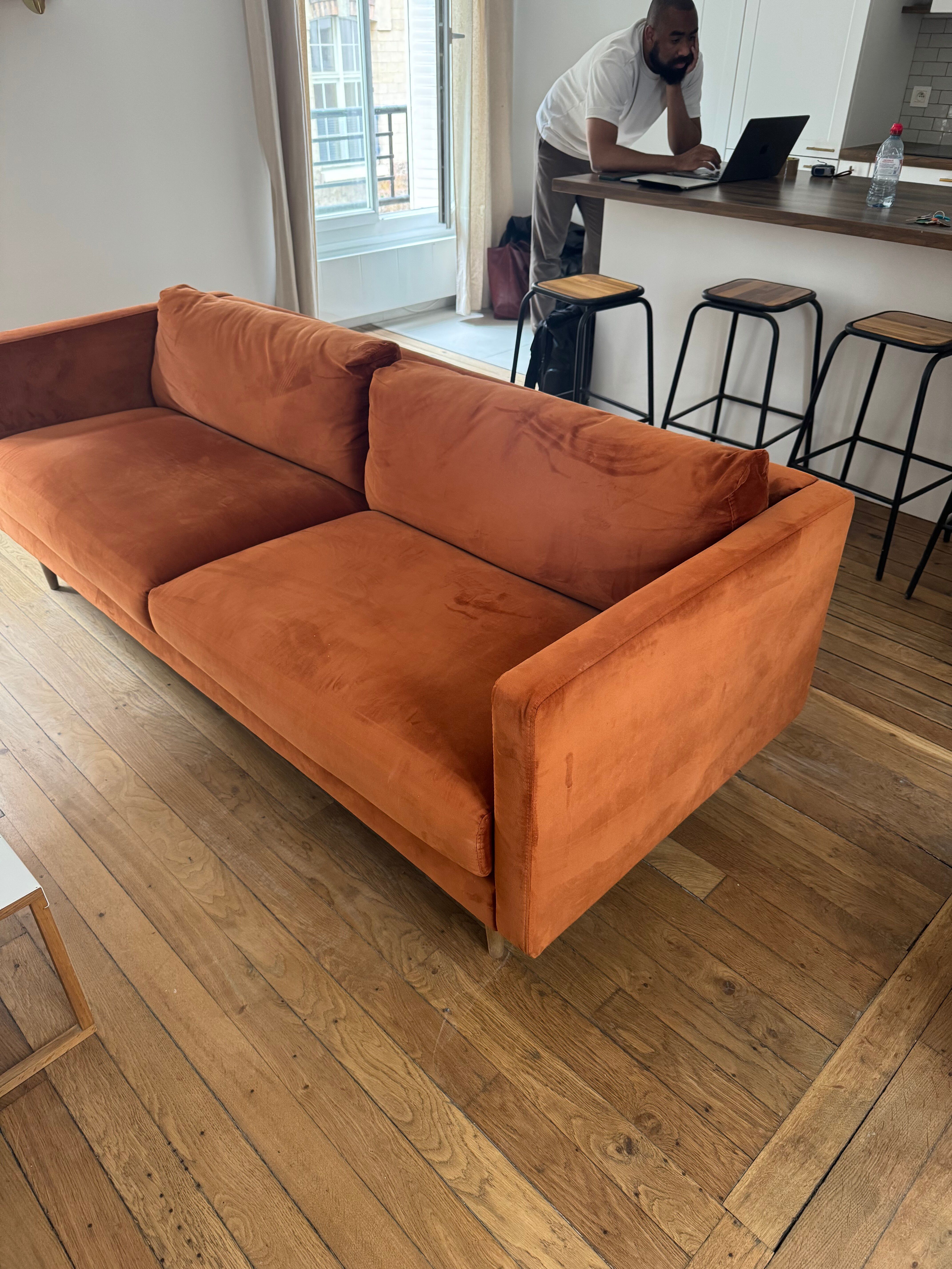 Orange velvet sofa