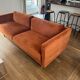 Orange velvet sofa