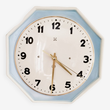 Antique clock in white and blue porcelain, gold fillet