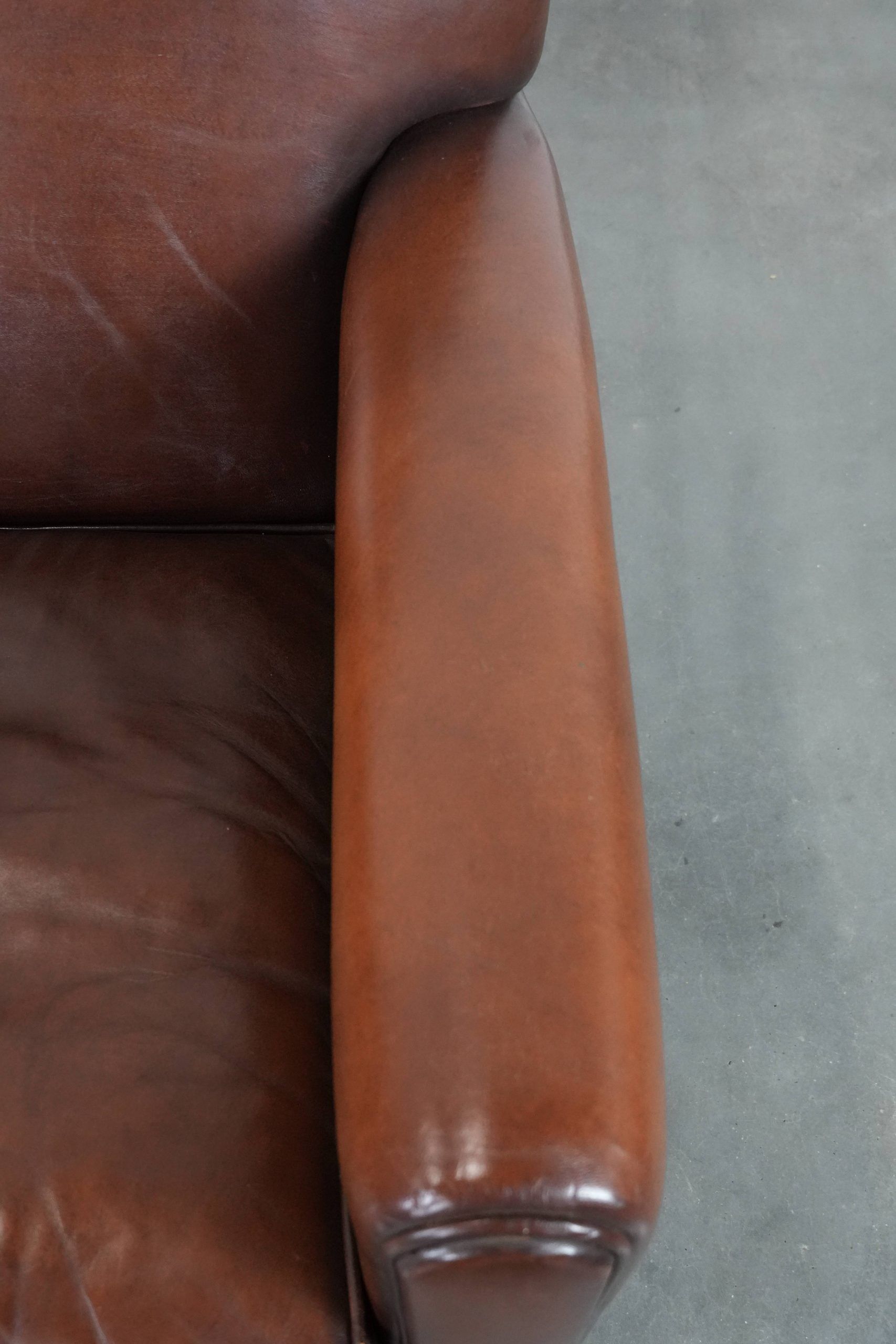 Sheepskin art deco design armchair with timeless and warm colours