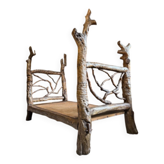 Brutalist bed in exotic wood from around 1970.