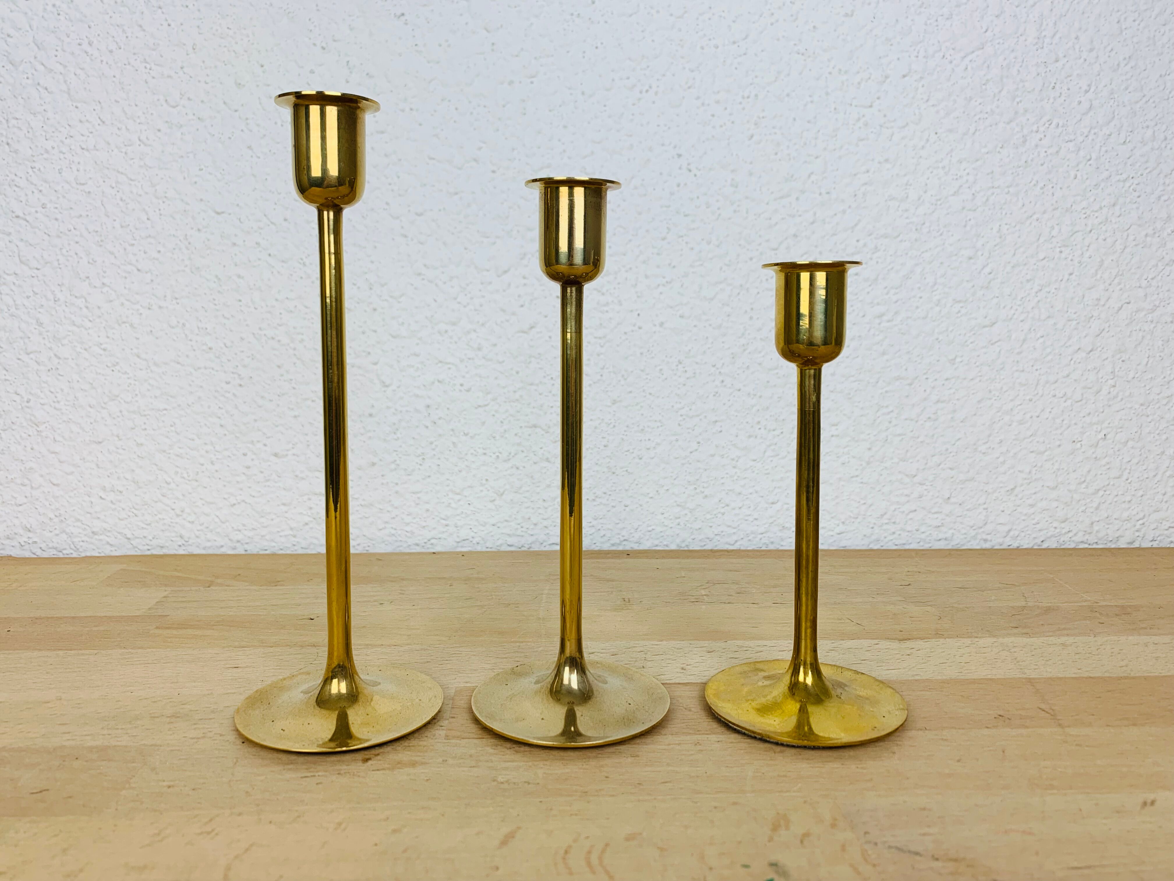 Three Scandinavian brass candle holders