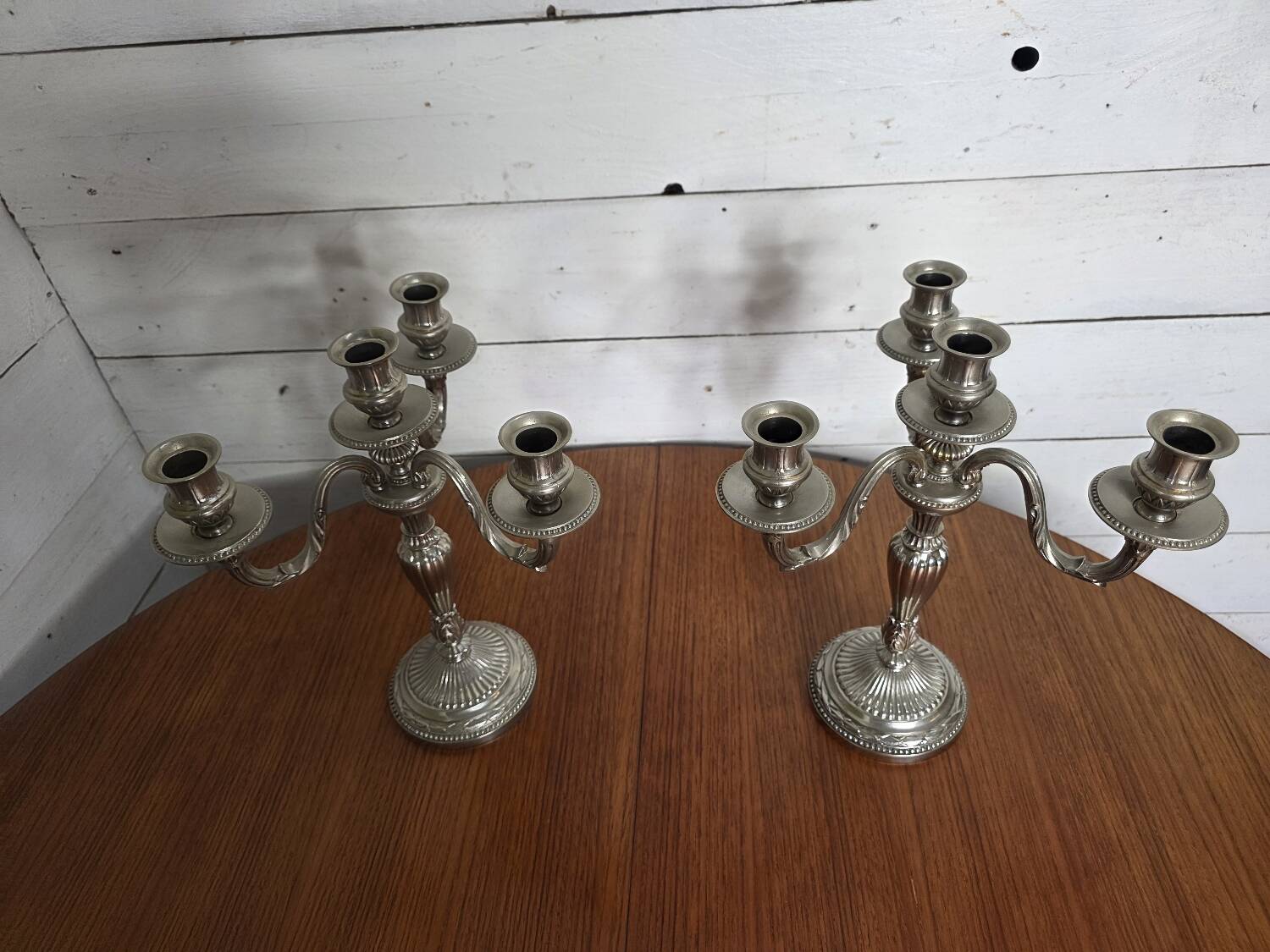 Pair of Louis XVI style candlesticks in silver-plated bronze
