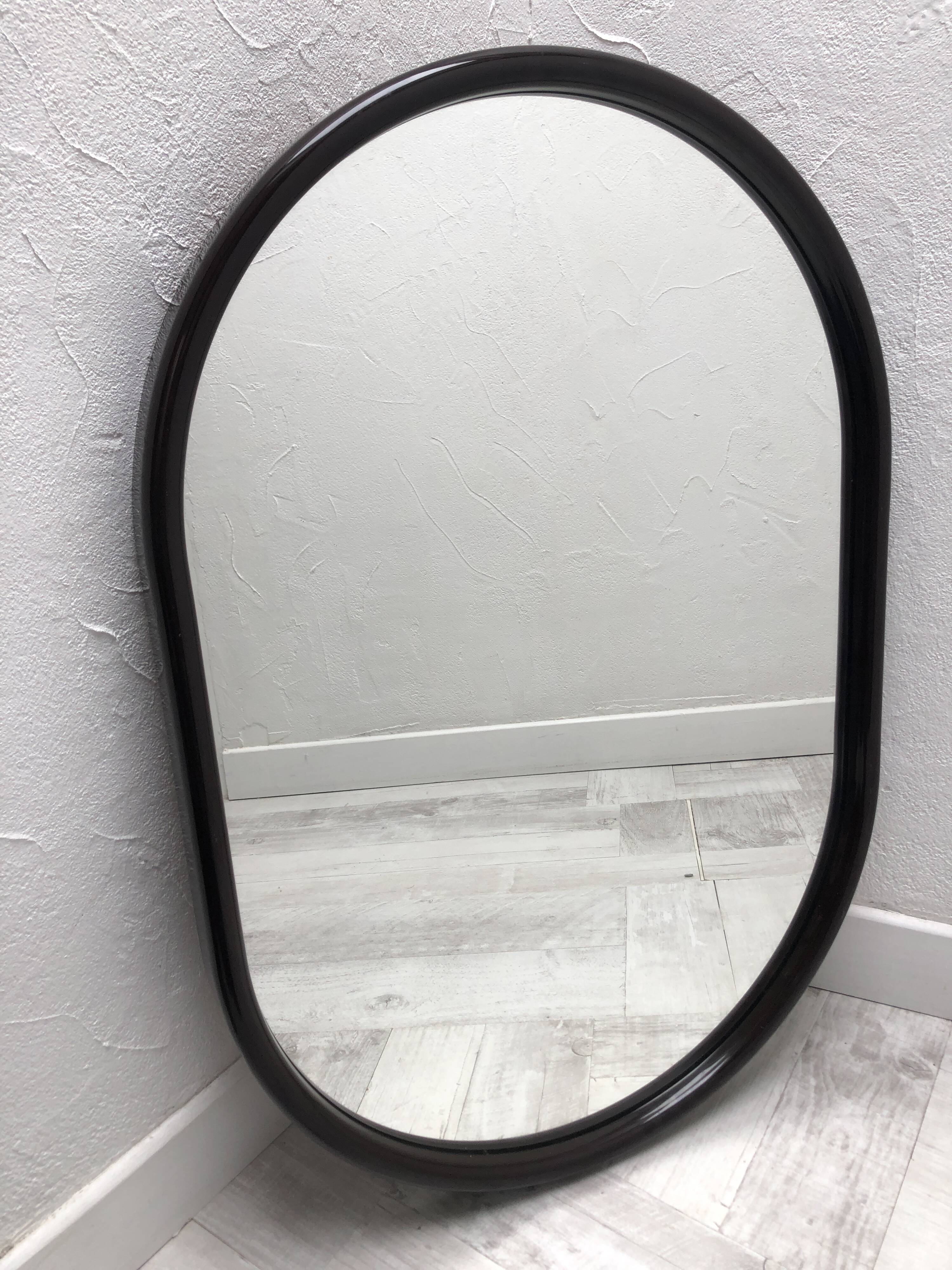 Brown plastic oval mirror, 1960s/1970s