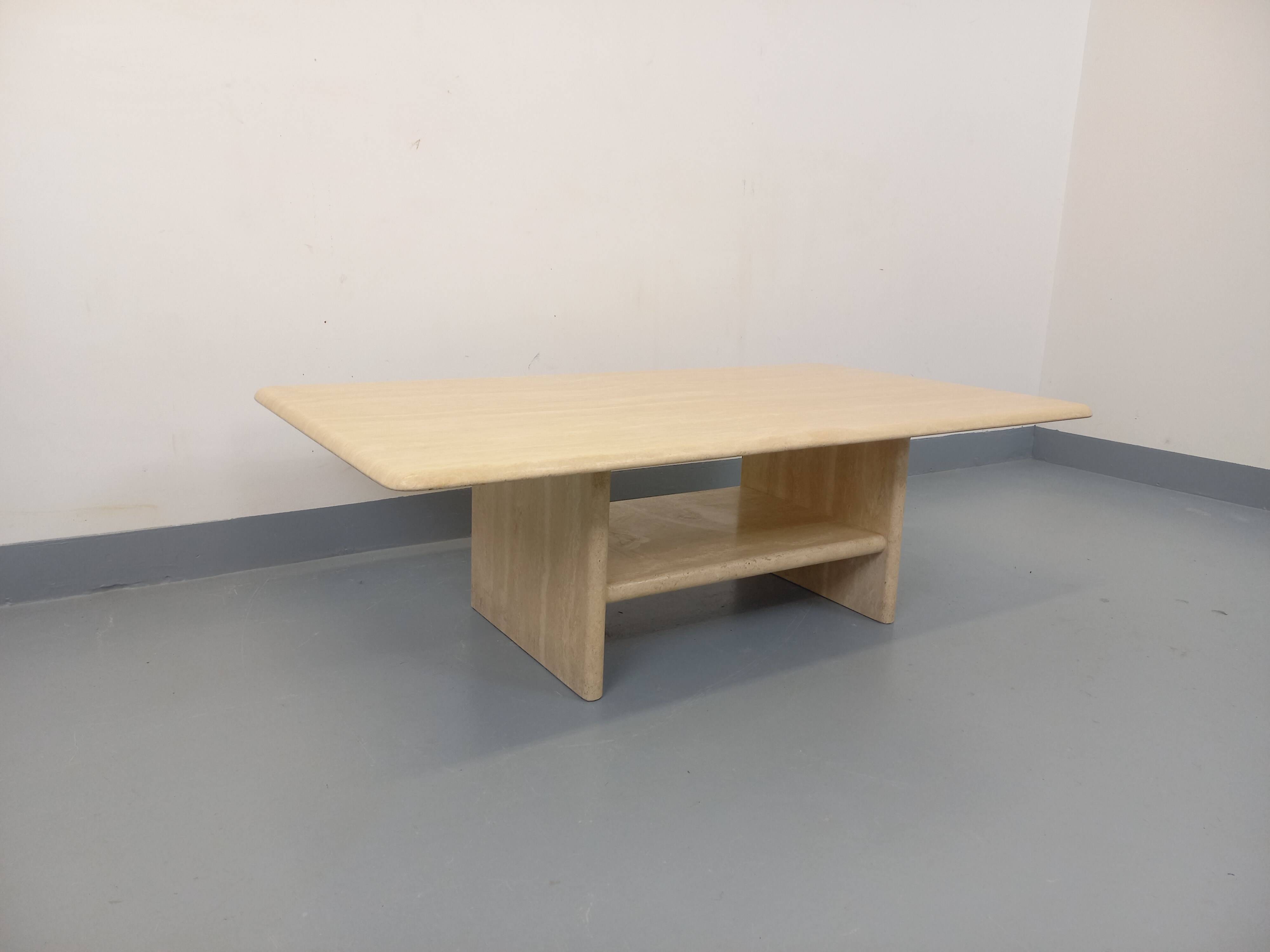 Vintage rectangular coffee table in travertine with magazine rack.