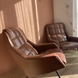 Pair of vintage armchairs in brown imitation leather