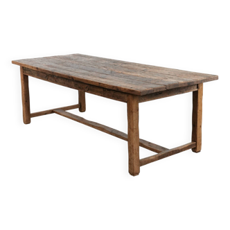 Magnificent and robust antique farmhouse dining table made of pine wood