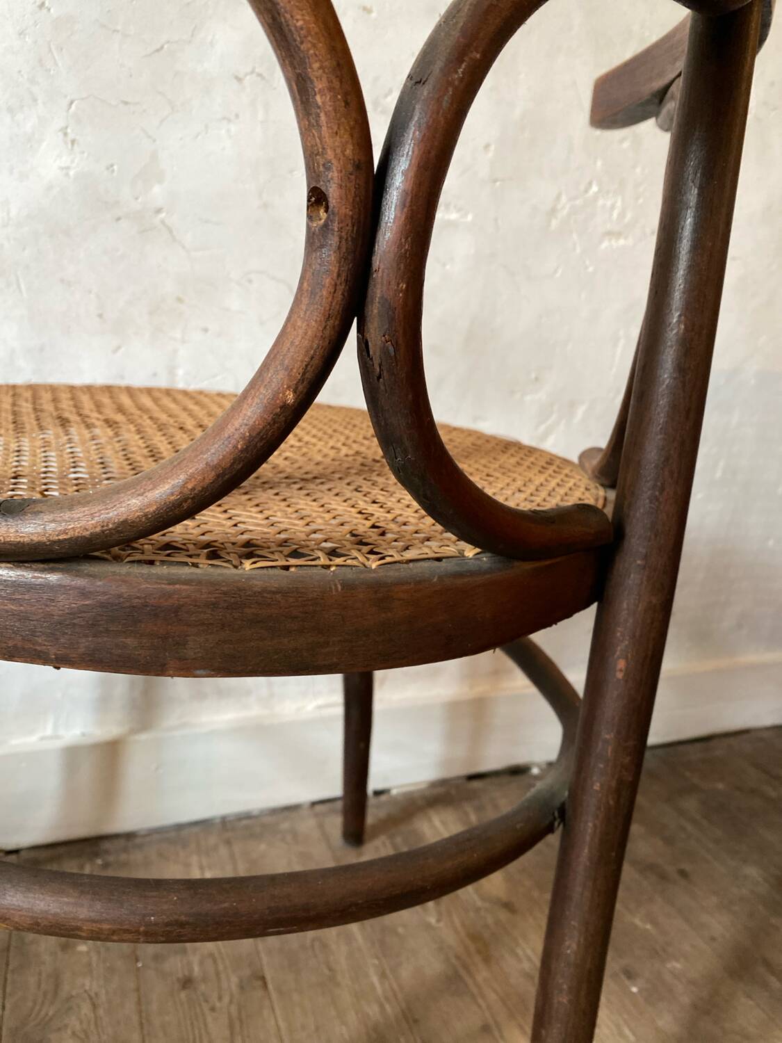 Cane and curved wood armchair