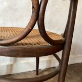 Cane and curved wood armchair