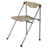Metal and lucite folding chair, swivel backrest.