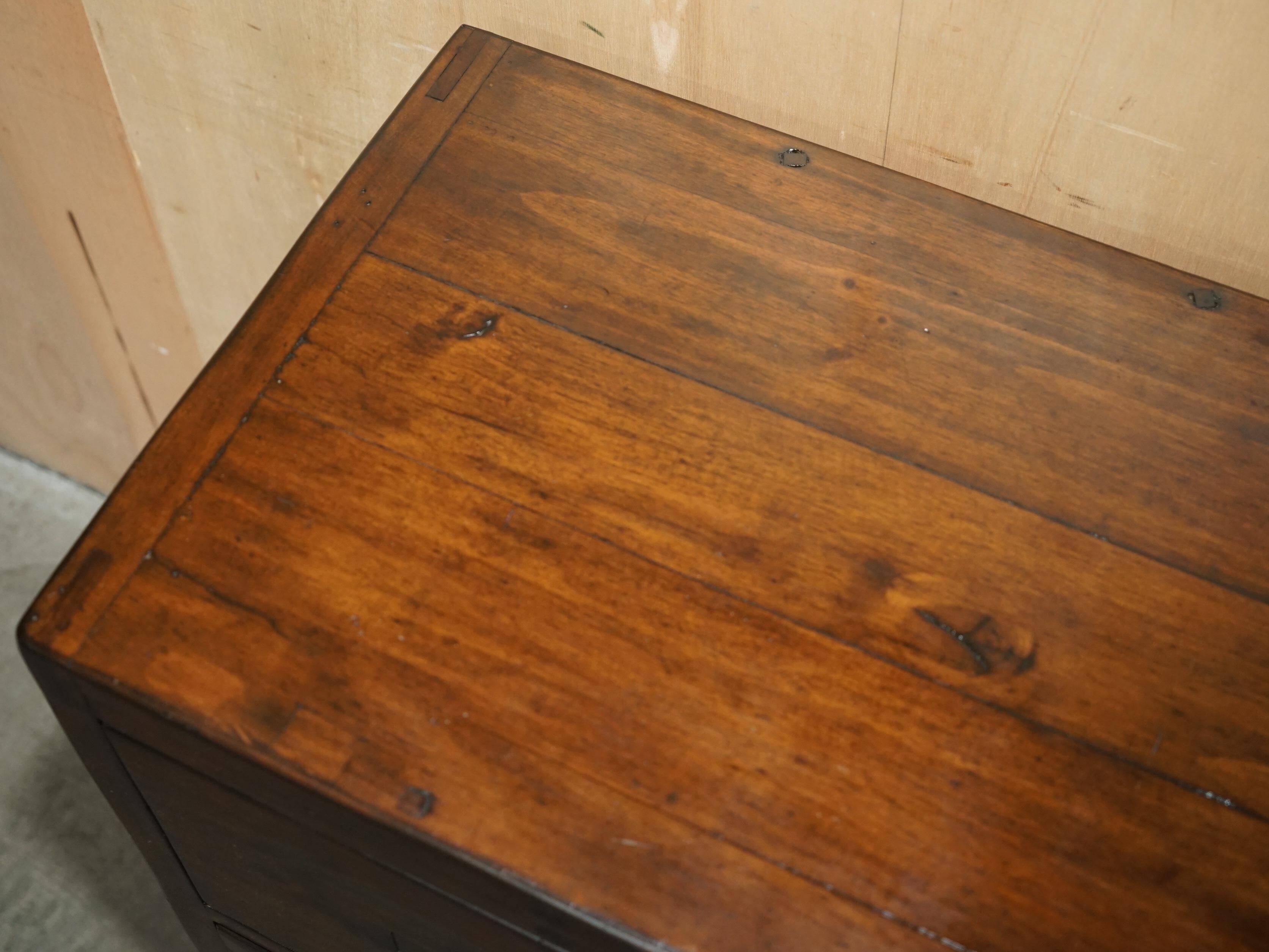 Large vintage hardwood furniture in military country style.