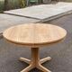 Scandinavian Baumann round extendable dining table with central leg, 115cm.