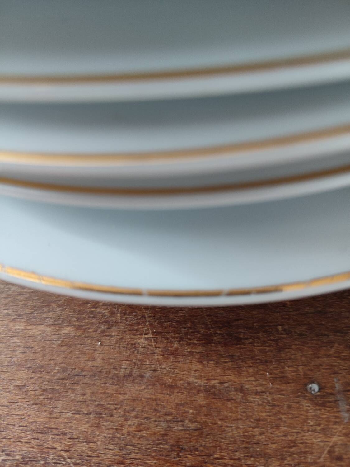 Set of 11 plates, Baudour porcelain