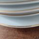 Set of 11 plates, Baudour porcelain