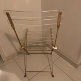 Folding chair in plexiglass and brass