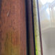 Vintage bevelled wall mirror in stained wood and brass