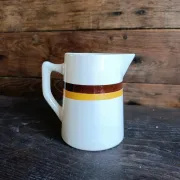 Vintage French ceramic pitcher with brown and ochre stripes