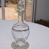 Blown glass decanter, engraved and chiselled. Made in France.