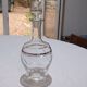 Blown glass decanter, engraved and chiselled. Made in France.