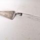 Silver metal pie shovel glass handle Lisa Mori