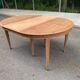 Renovated round extendable dining table made of solid mahogany from the 19th century.