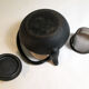 Black cast iron teapot