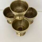 4 golden brass egg cups