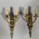 According to Jean-Charles Delafosse (1734-1791). Pair of bronze wall sconces.