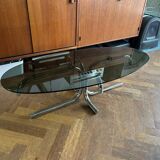 70s design oval coffee table in smoked black glass with chrome legs.
