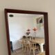 Beautiful vintage Danish teak mirror with mittered edges and nice brass det