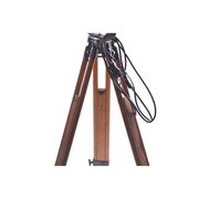 Old industrial spot on wooden tripod
