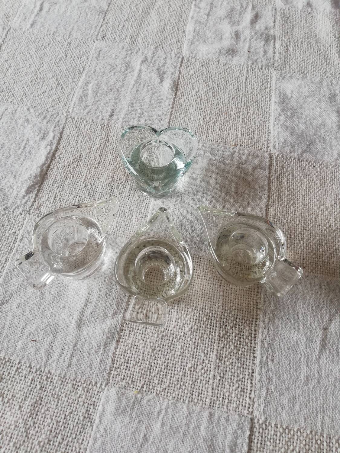 Set of four small transparent glass candle holders 3 spikes 1 heart