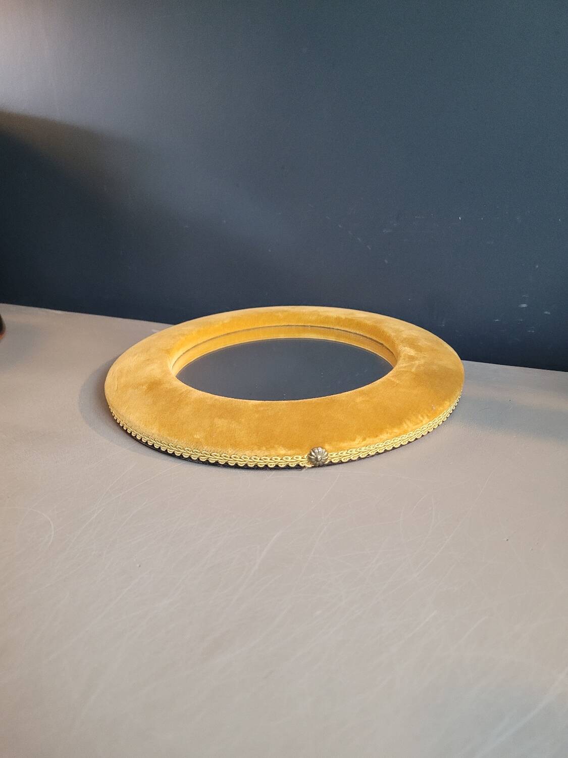 Vintage mirror with mustard velvet frame