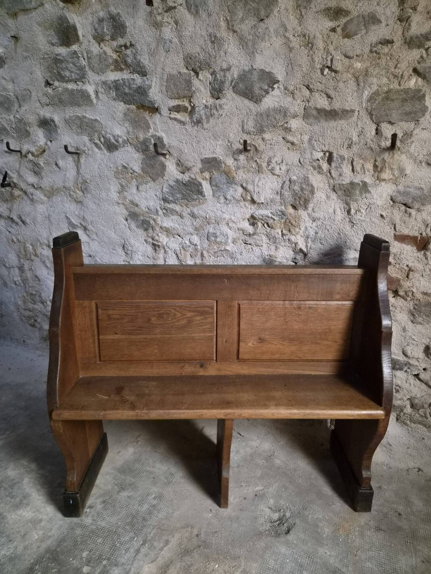 Antique church bench in oak, circa 1900–1920