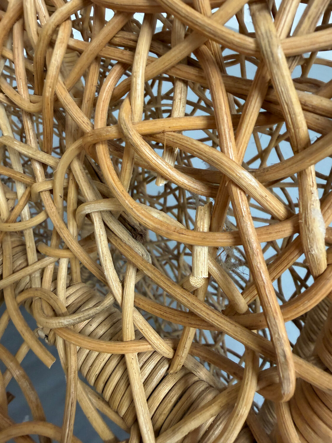Sculptural woven rattan armchair, organic design from the 1970s.