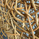 Sculptural woven rattan armchair, organic design from the 1970s.