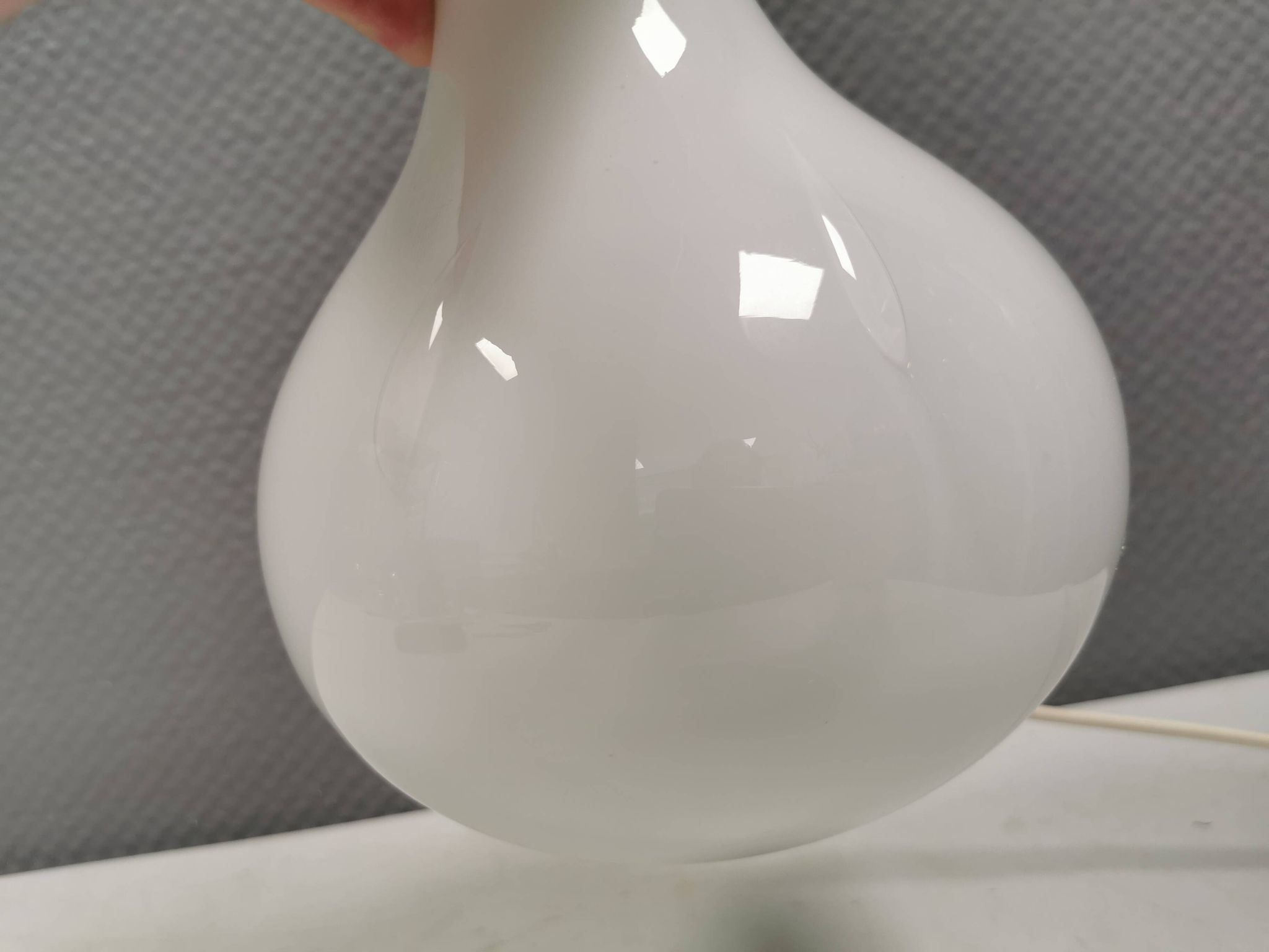 Helios table lamp, teardrop shaped, made of white opal glass. 1986 Denmark
