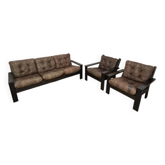 Salon canapé et fauteuils brutalistes, cuir et bois, années 70