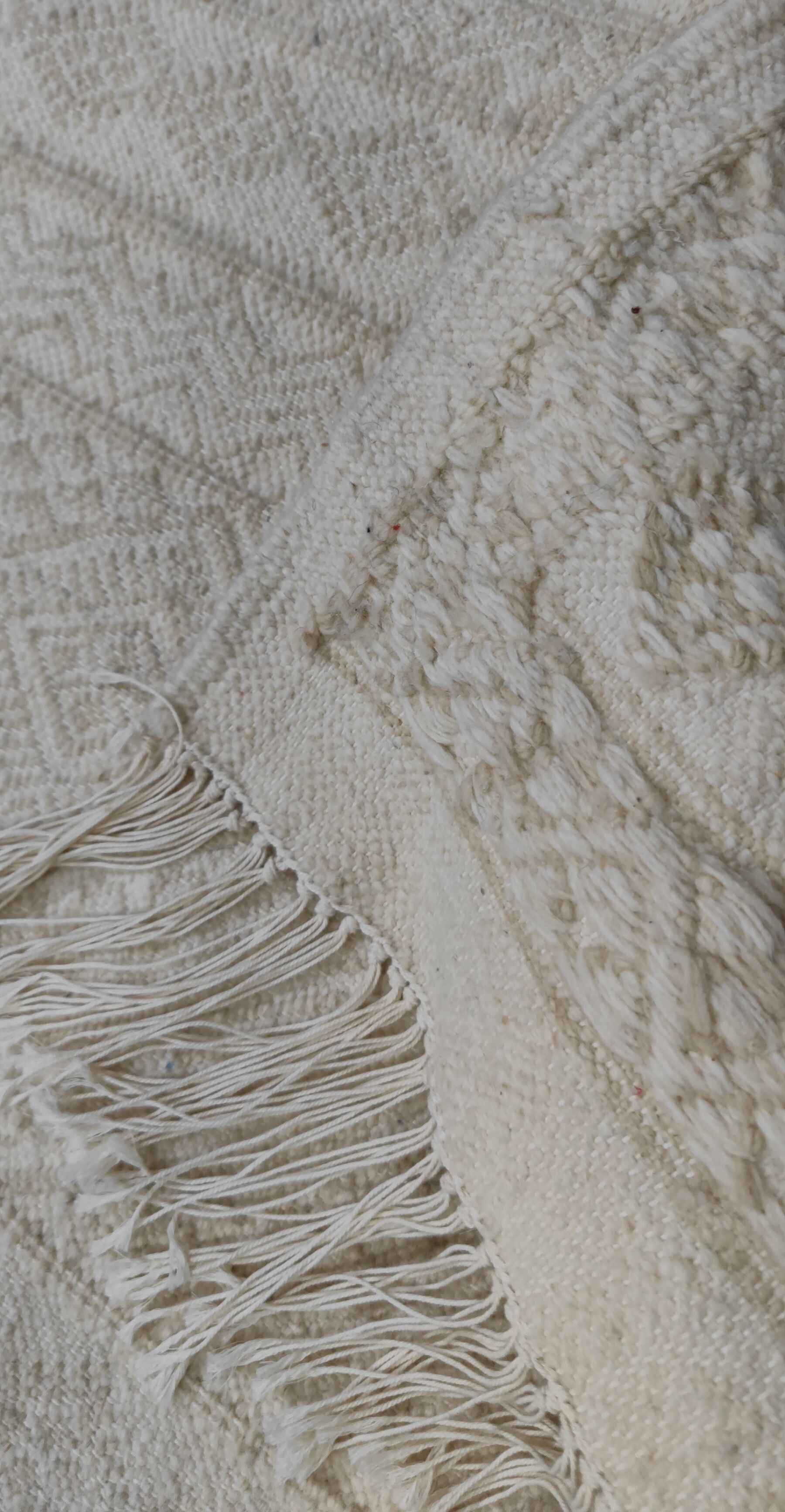 Hand-woven rug in natural wool